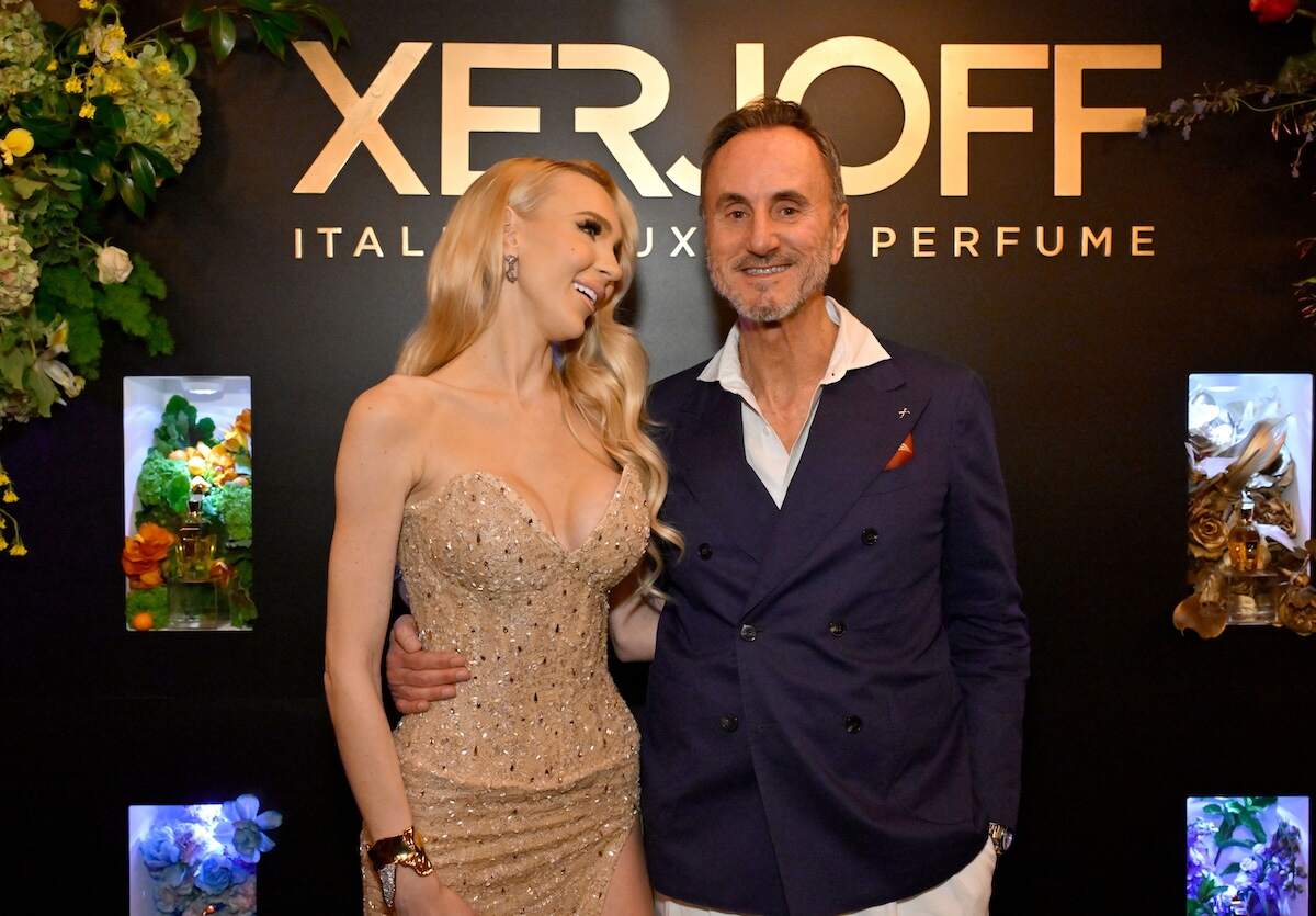 Reality star Christine Quinn looks at Alberto Pasquarelli as they pose for a photo at a perfume event