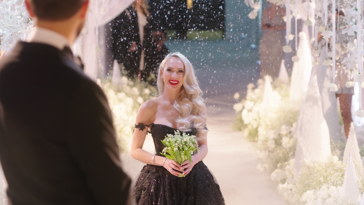 Christine Quinn in a black dress at her wedding on 'Selling Sunset'