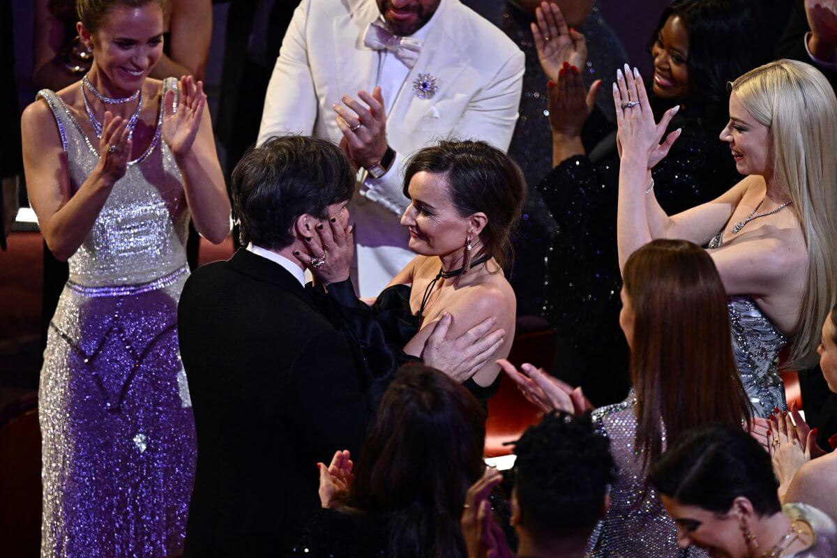 Cillian Murphy embraces his wife, Yvonne McGuinness, at the Academy Awards.