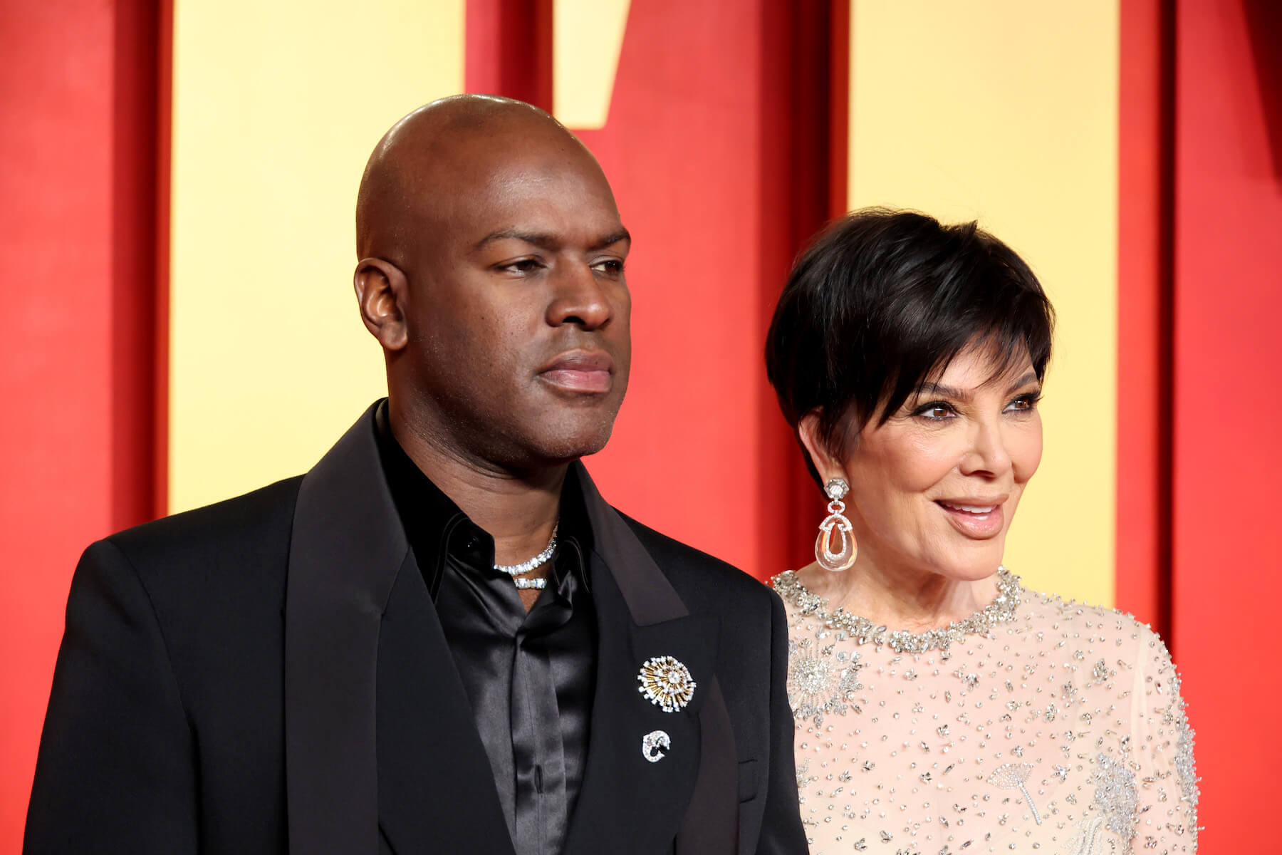 Corey Gamble and Kris Jenner arm-in-arm at the Vanity Fair Oscar party in 2024