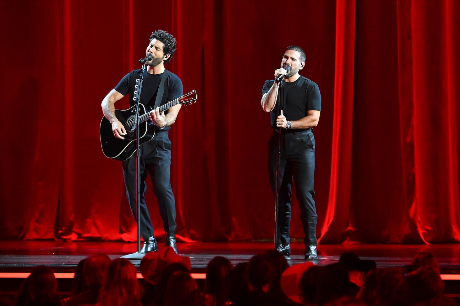 Dan Smyers and Shay Mooney of Dan + Shay singing and performing on stage