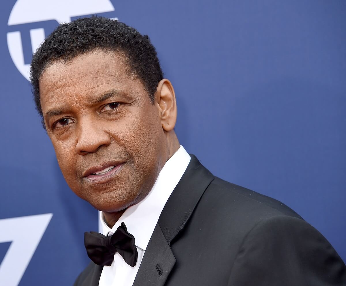 Denzel Washington posing in a suit at the American Film Institute's 47th Life Achievement Award Gala Tribute To Denzel Washington.