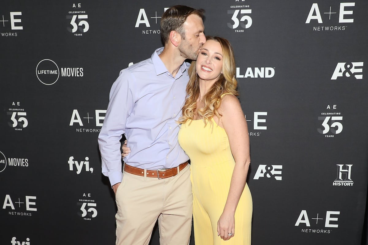 'Married at First Sight' cast member Doug Hehner kissing his wife Jamie Otis on the forehead at an A&E even in 2019