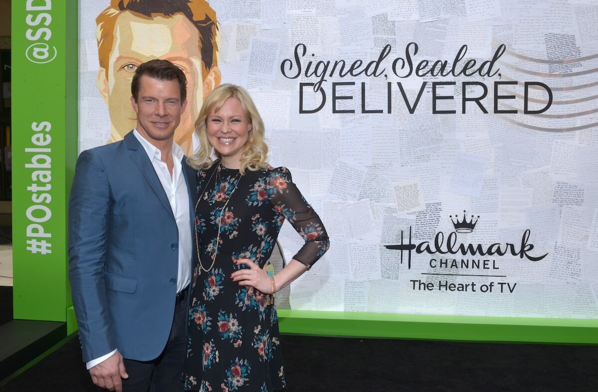 Eric Mabius and Kristin Booth pose for a photo at as 'Signed, Sealed, Delivered' event