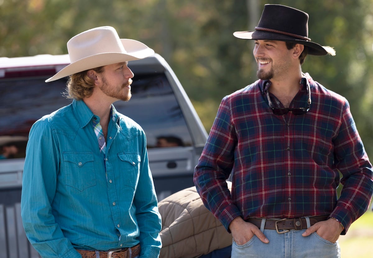 Farmer Nathan and Farmer Mitchell, wearing cowboy hats and talking to each other, in 'Farmer Wants a Wife' Season 2
