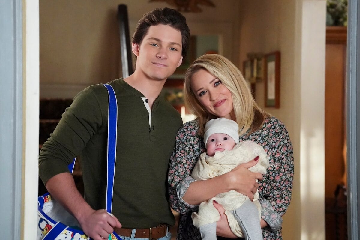 Montanta Jordan as Georgie and Emily Osment as Mandy (holding her infant daughter) in 'Young Sheldon'