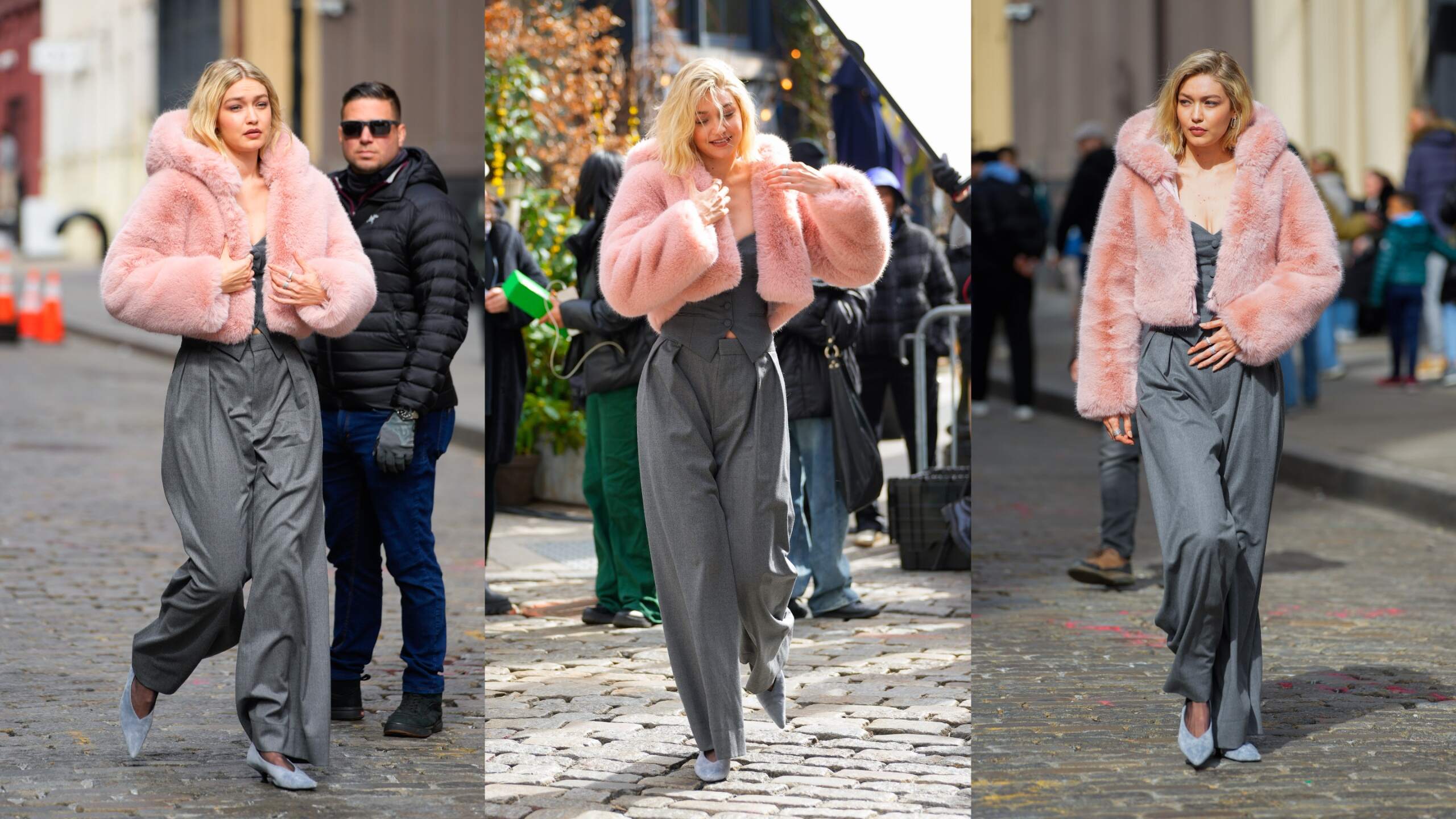 Model Gigi Hadid wears a pink faux fur coat and walks on an NYC street for a photoshoot