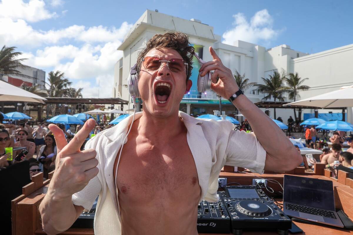 DJ James Kennedy performs during a spring break concert at Mandala Beach