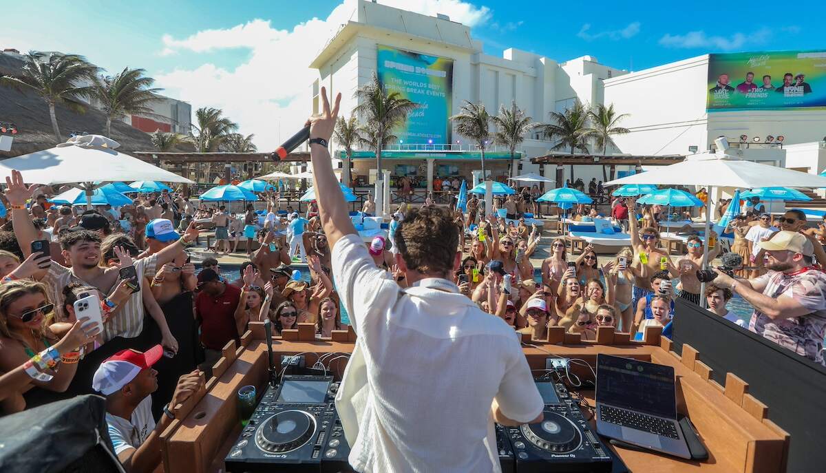 Vanderpump Rules star James Kennedy djs in Cancun to an excited crowd while wearing a white unbuttoned shirt