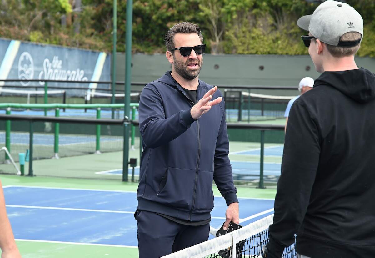 Former Hills star Jason Wahler gestures to his pickleball appointment from across the net