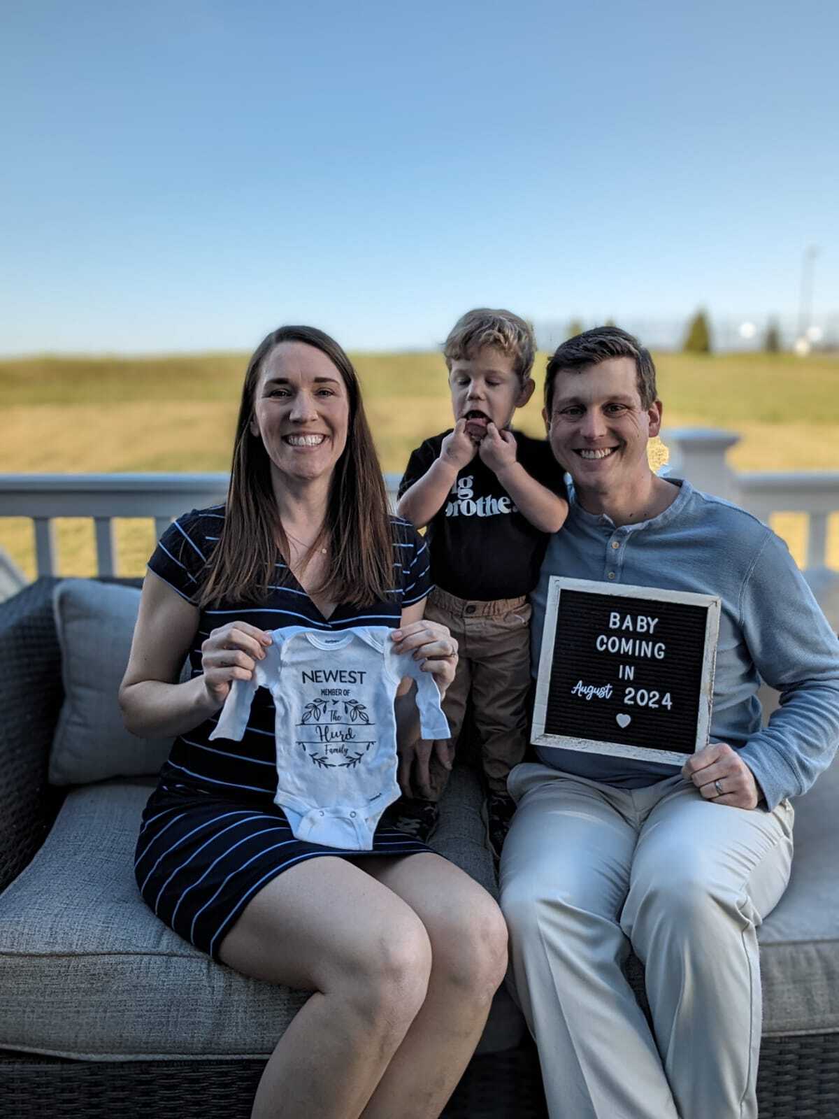 'Married at First Sight' alums Jessica Studer and Austin Hurd with their toddler son and a sign announcing her pregnancy