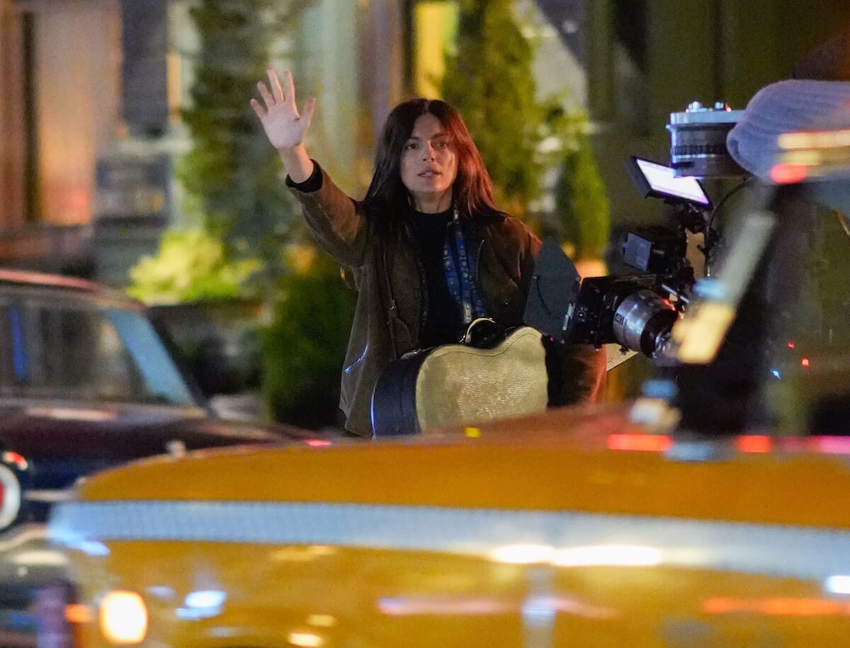 Monica Barbaro, as Joan Baez, hails a cab while filming 'A Complete Unknown' in NYC