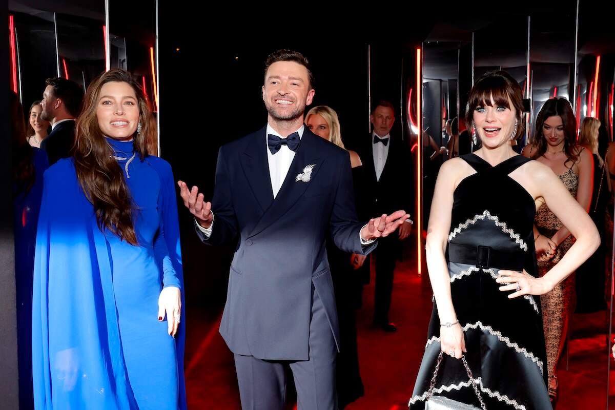 Jessica Biel, Justin Timberlake, and Zooey Deschanel laugh together at the 2024 Vanity Fair Oscar Party