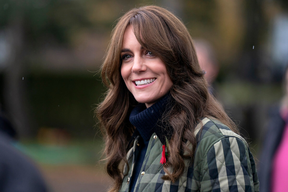 Kate Middleton, whose edited Mother's Day photo controversy Kensington Palace is done discussing, smiles and looks on