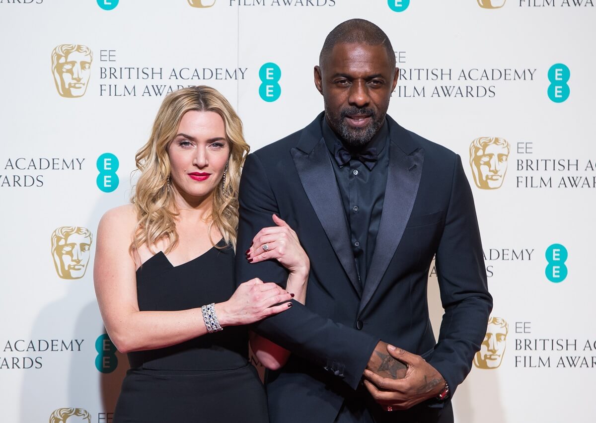 Kate Winslet and Idris Elba pose in the winners room at the EE British Academy Film Awards.
