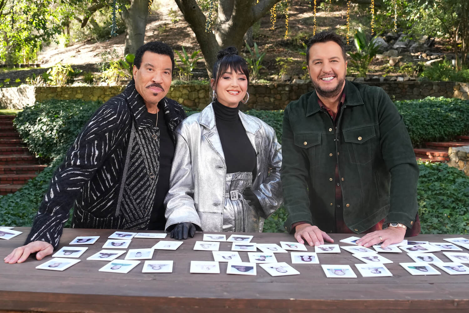 'American Idol' judges Lionel Richie, Katy Perry, and Luke Bryan smiling while outdoors