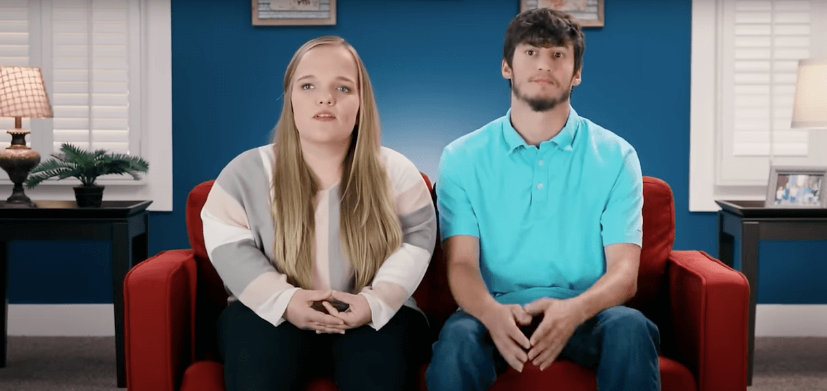 Liz Johnston and Brice Bolden sitting on a couch in '7 Little Johnstons'