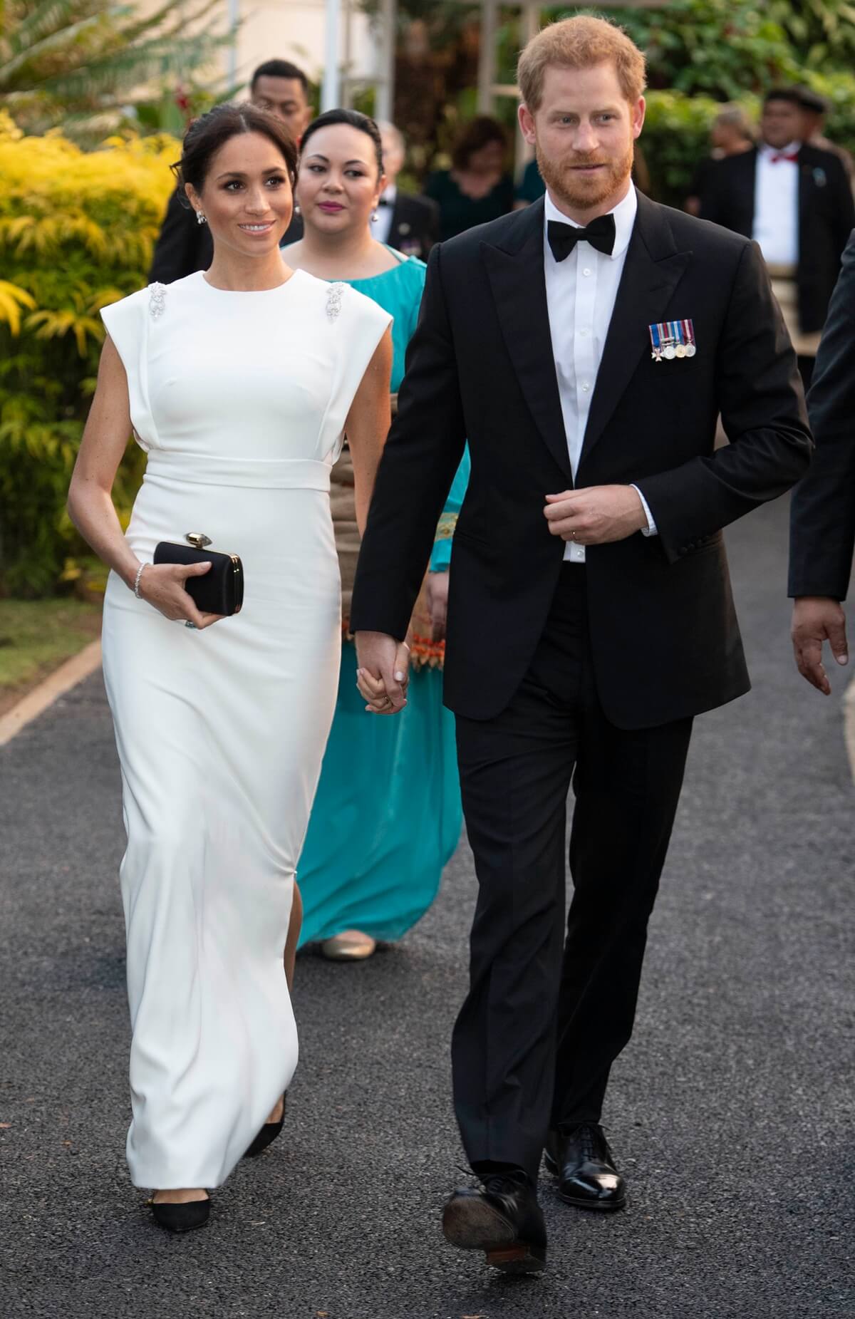 Meghan Markle and Prince Harry attend a state dinner at the Royal Residence in Nuku'alofa, Tonga