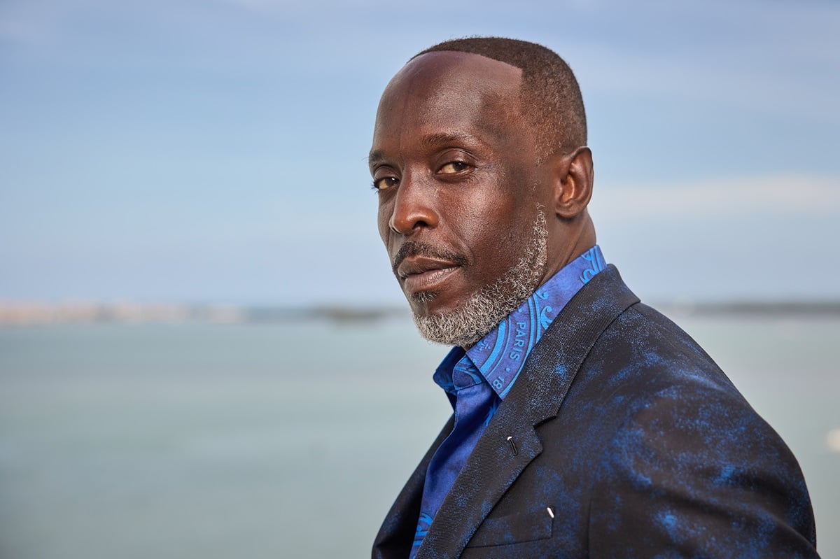 Michael K. Williams posing in a blue suit at the 27th Annual Screen Actors Guild Awards.