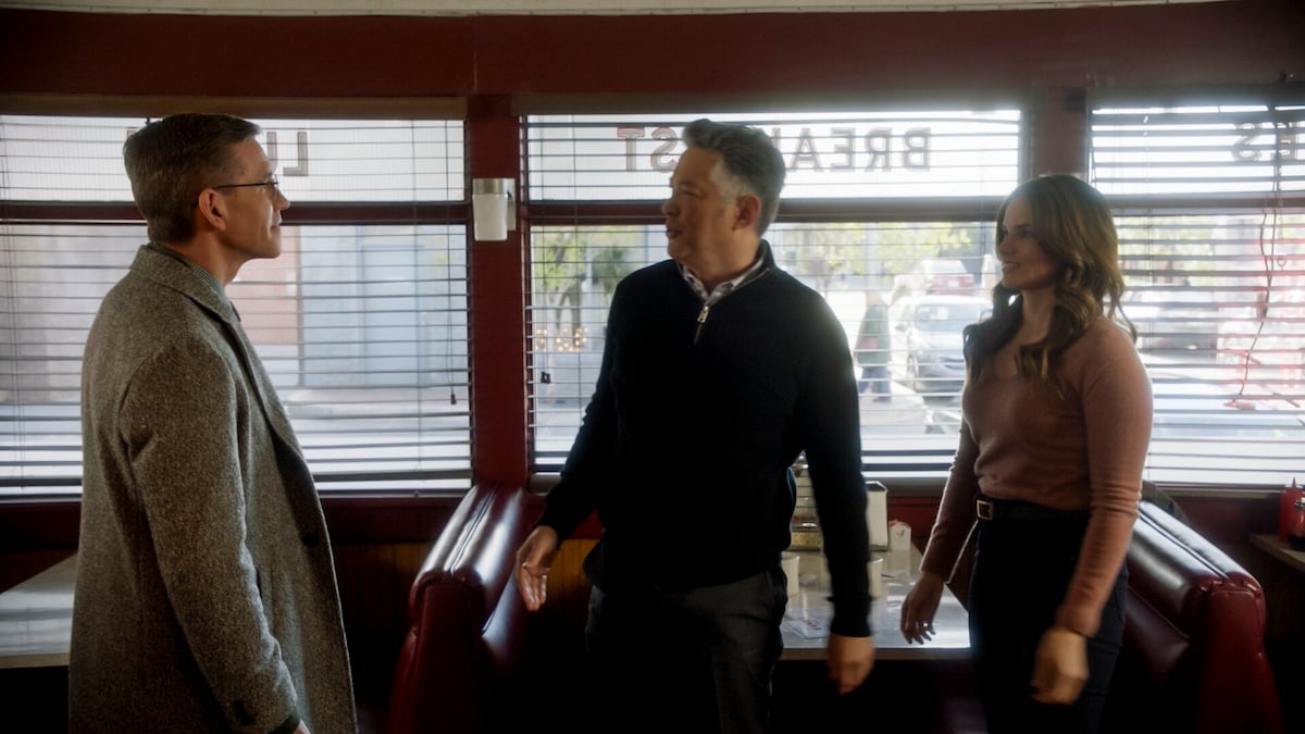 Three people standing in a diner in 'NCIS'