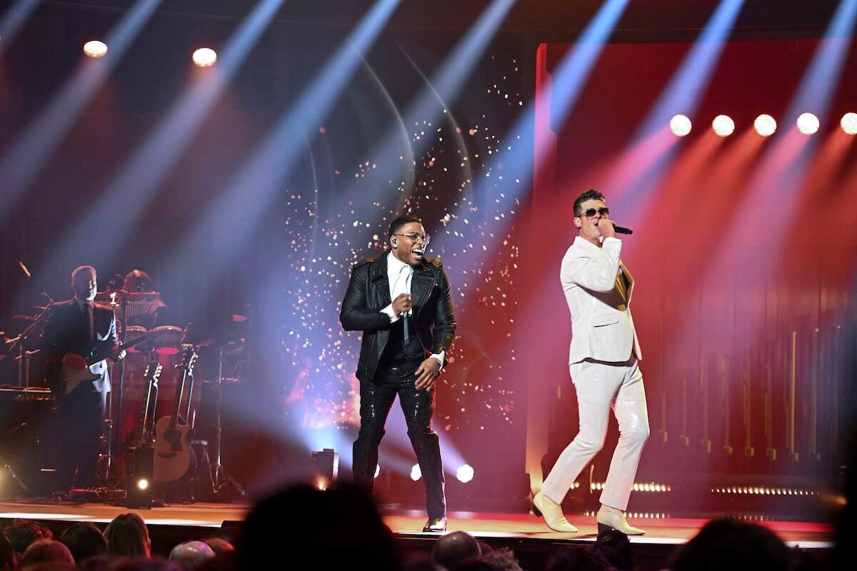 Nelly and Robin Thicke perform in front of pyrotechnics for Kevin Hart