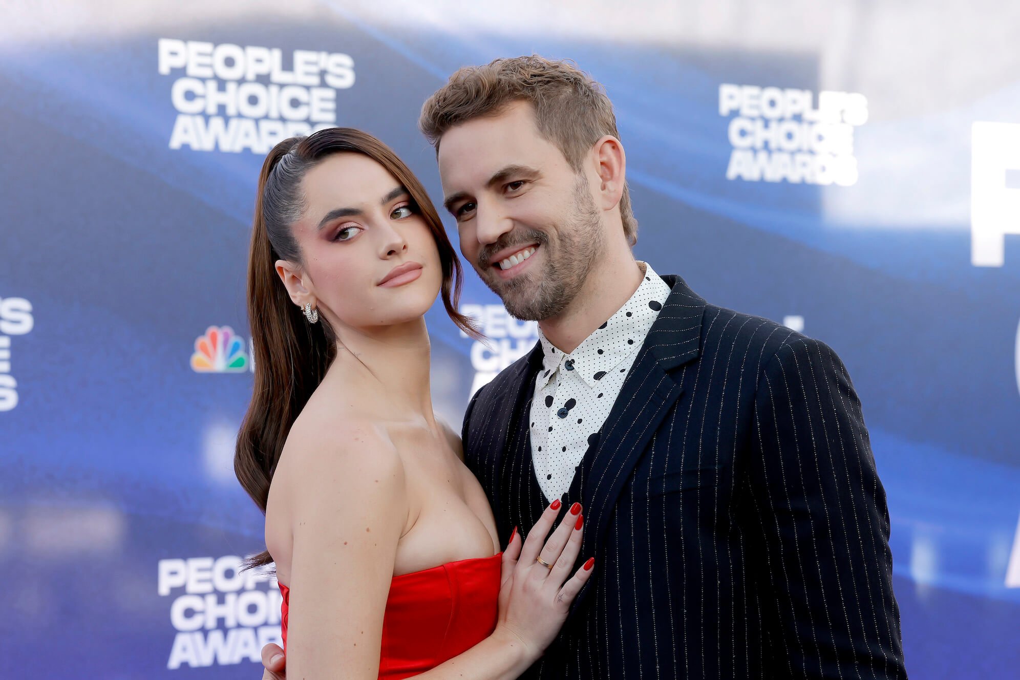Natalie Joy and Nick Viall hugging and posing at an event