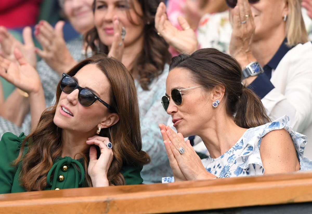 Pippa Middleton speaking to her sister, Kate Middleton, in the Royal Box during the 2019 Wimbledon Tennis Championships