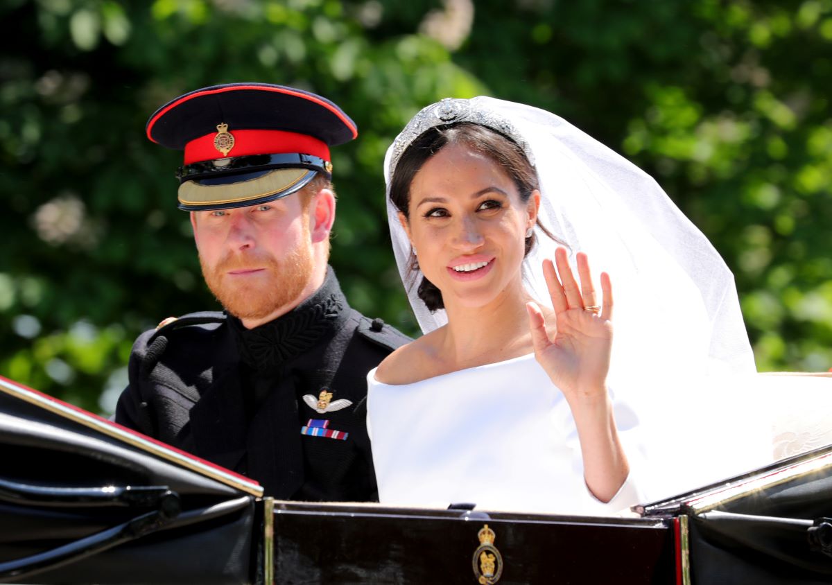 Prince Harry and Meghan Markle ride in a carriage during the procession after getting married at St. George's Chapel, Windsor Castle