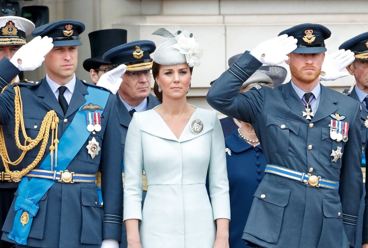 Prince William, Kate Middleton, and Prince Harry attend a ceremony to mark the centenary of the Royal Air Force on the forecourt of Buckingham Palace