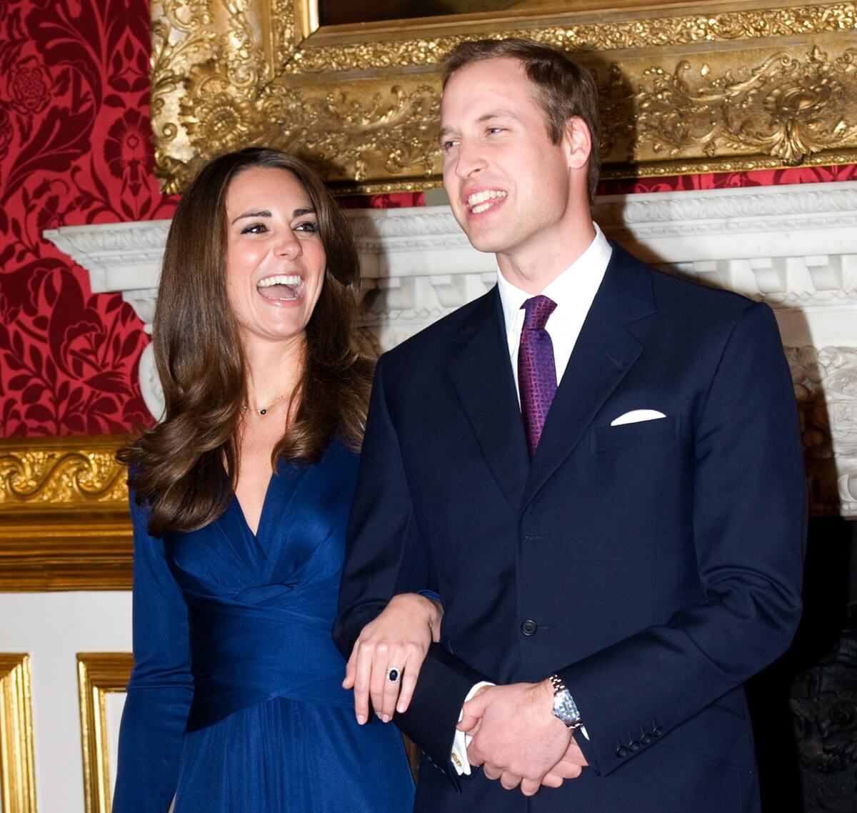 Prince William and Kate Middleton pose for photographs after announcing their engagement