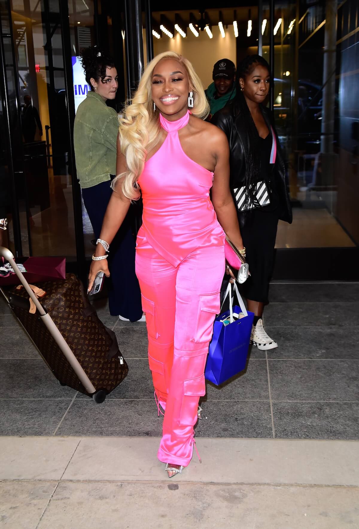 Quad Webb in a pink jumpsuit