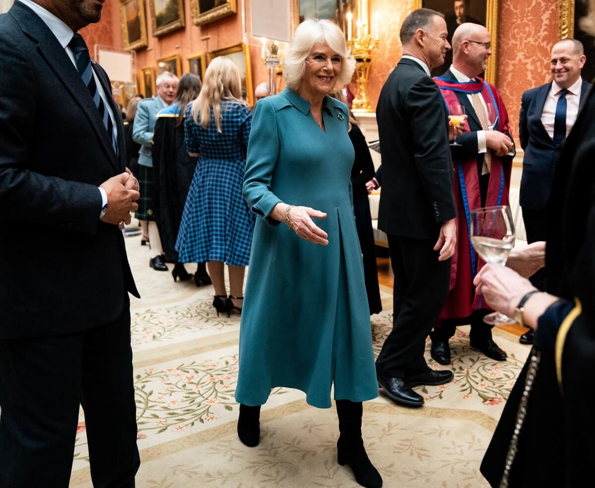 Queen Camilla meets guests after presenting the Queen's Anniversary Prizes for Higher and Further Education, during an event at Buckingham Palace