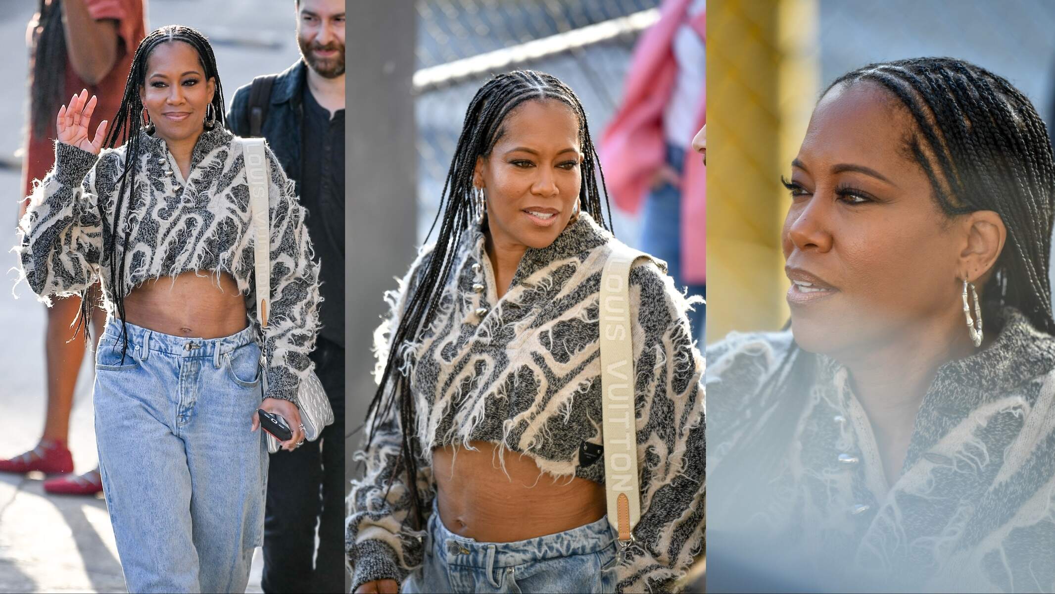 Wearing baggy jeans and a crop top, Regina King waves to fans while walking in NYC