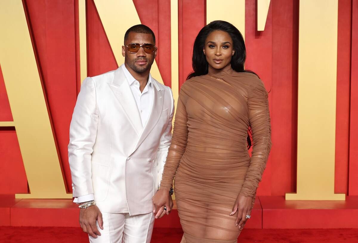 Married couple Russell Wilson and Ciara pose for photos at the 2024 Vanity Fair Oscar Party three months after the birth of their fourth child