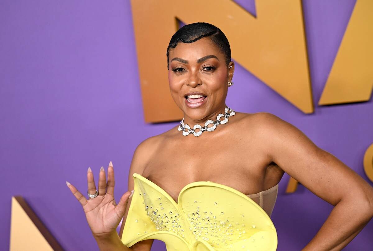 Actor Taraji P. Henson laughs and waves at a photographer on the red carpet at the 55th NAACP Image Awards