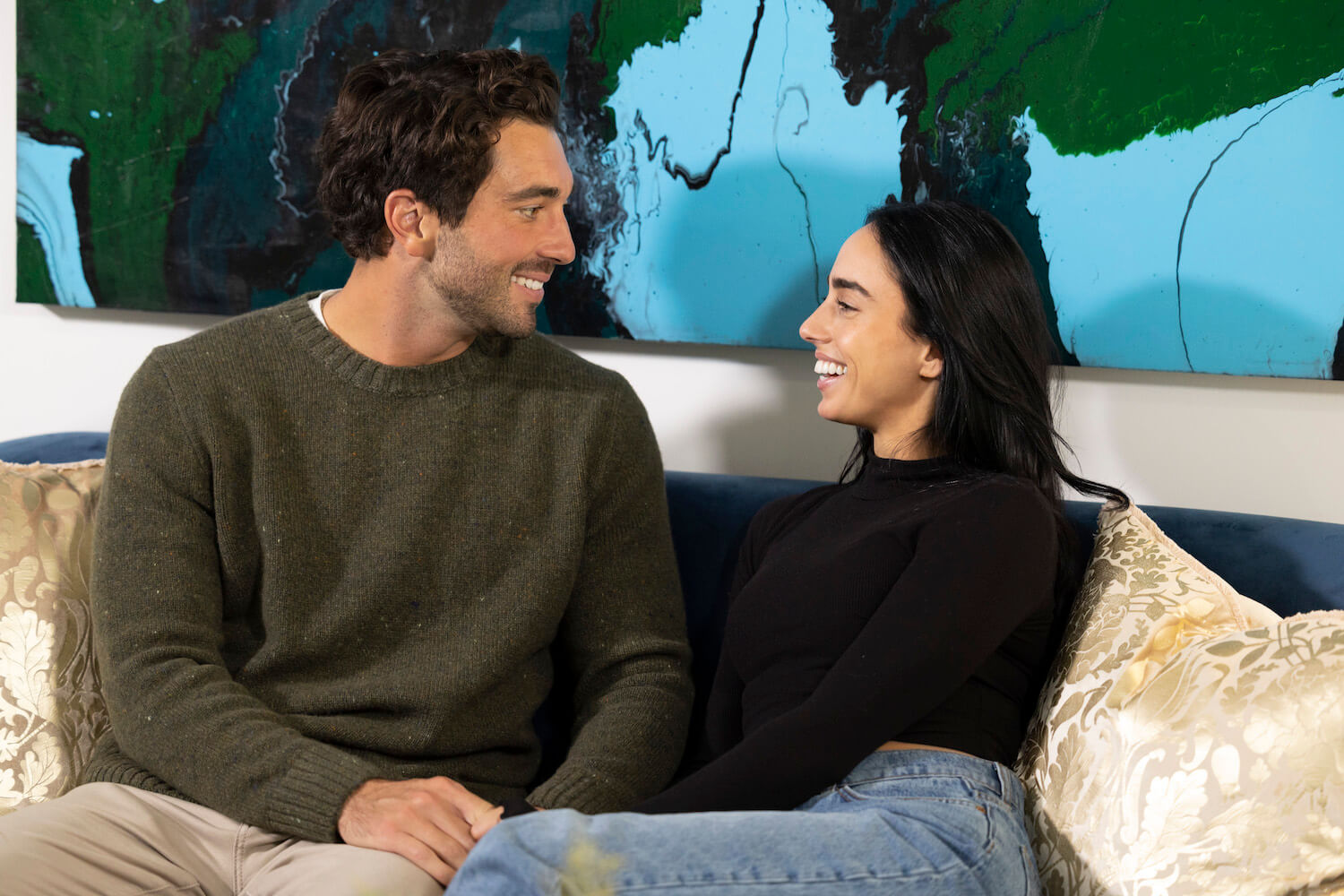 'The Bachelor' Season 28 star Maria Georgas looking into Joey Graziadei's eyes while sitting on a couch