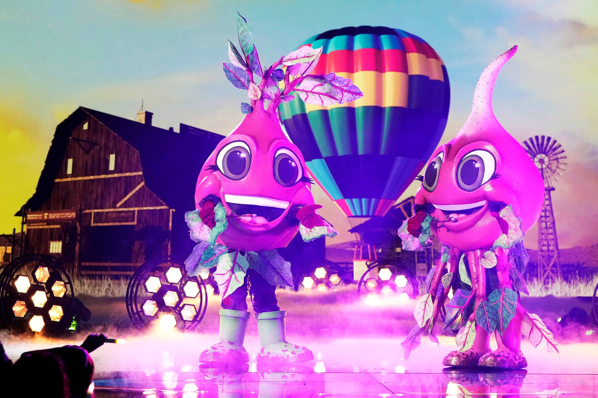 The Beets singing on 'The Masked Singer' Season 11 stage with a hot air balloon behind them