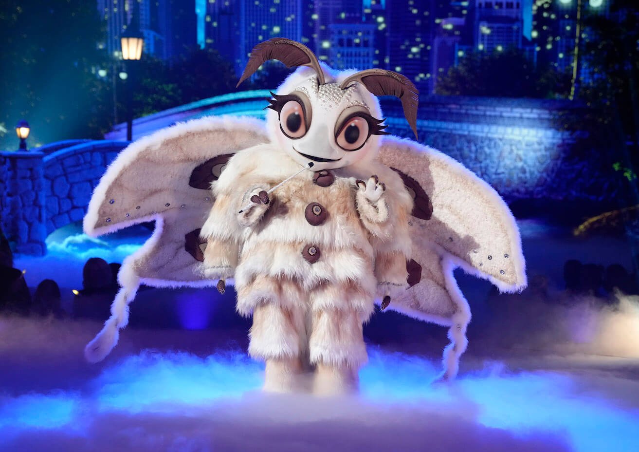 'The Masked Singer' Season 11 Group C singer Poodle Moth on stage illuminated by blue light