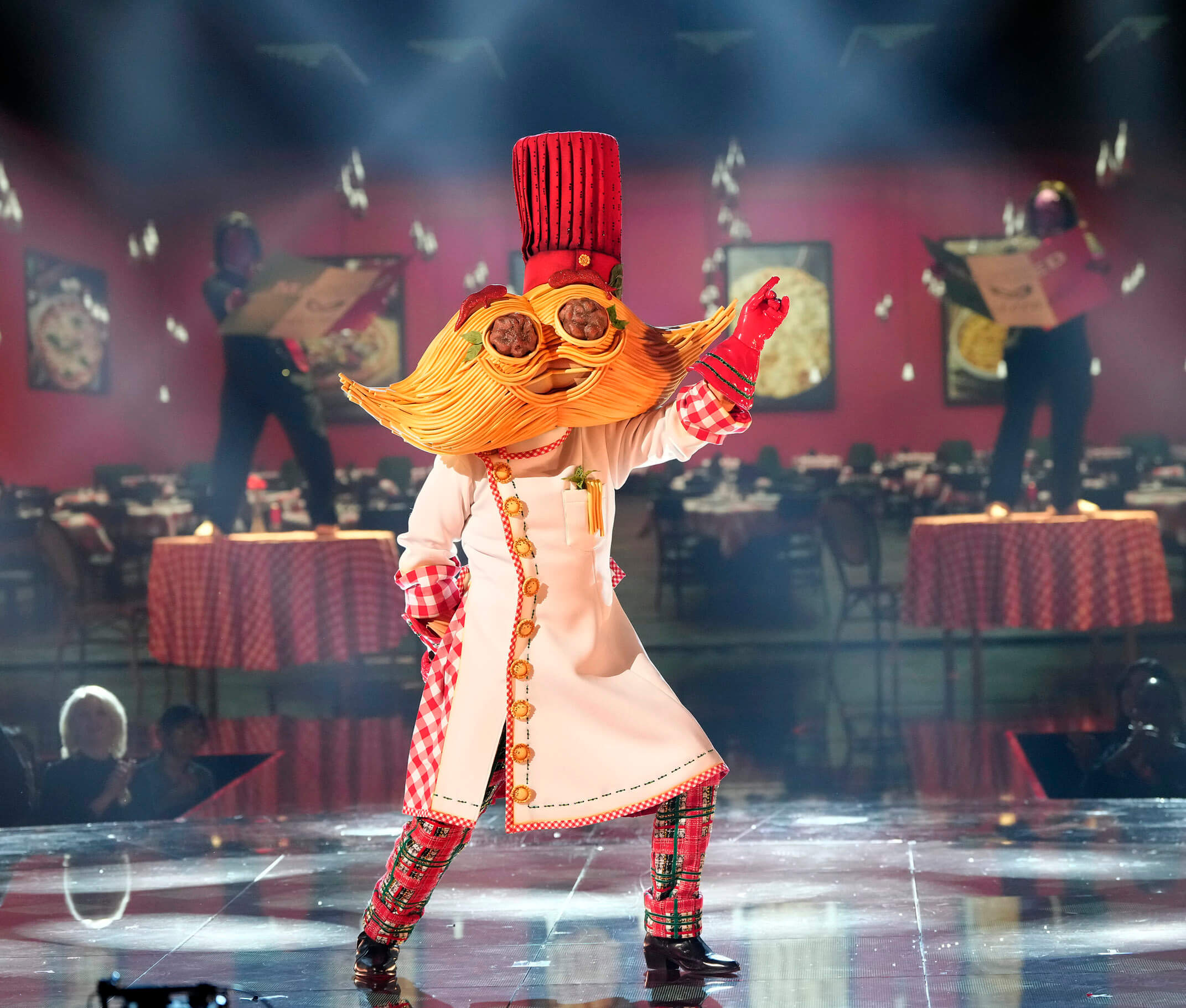 'The Masked Singer' Season 11 Group C singer Spaghetti and Meatballs on stage with Italian restaurant decor