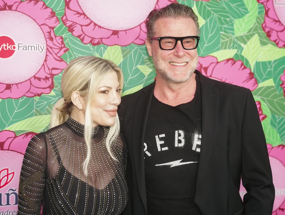 Tori Spelling poses for a photo with Dean McDermott in 2023