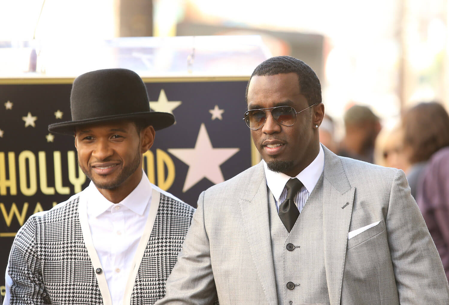 Usher and Sean 'P. Diddy' Combs dressed in suits at an event together