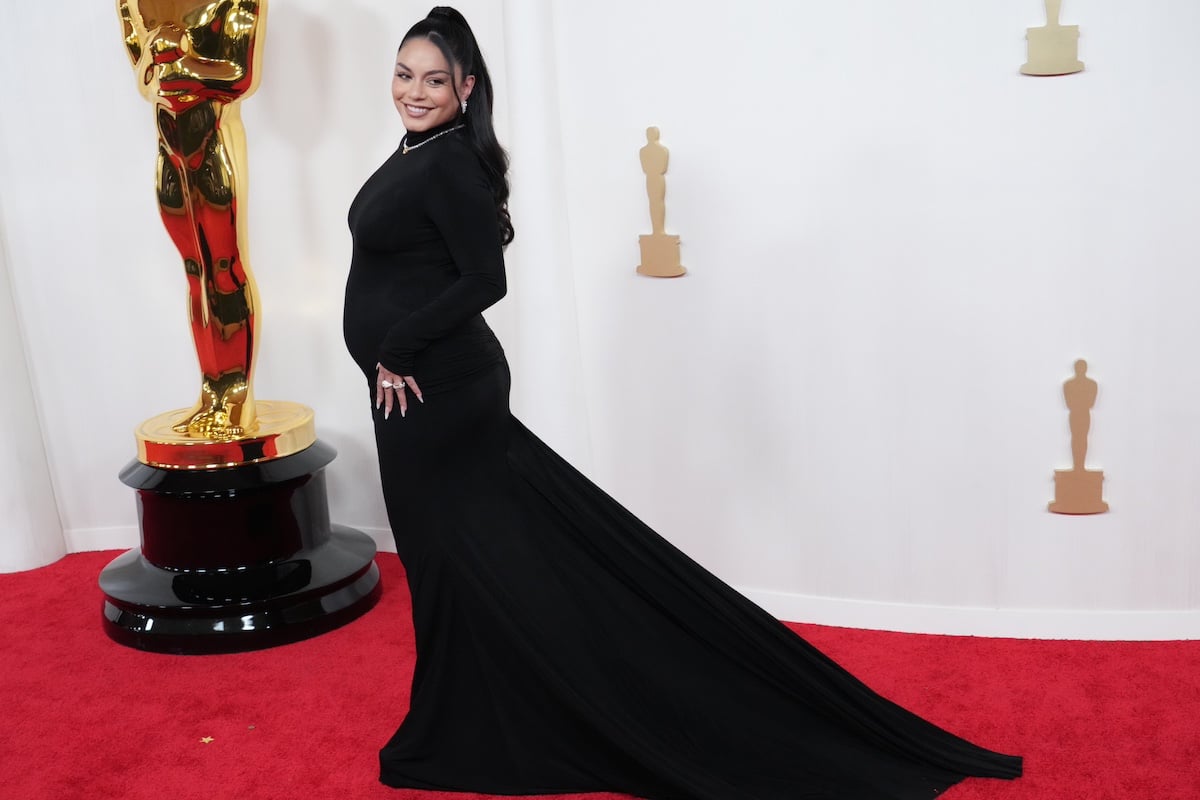 Vanessa Hudgens poses in profile on the 2024 Oscars red carpet