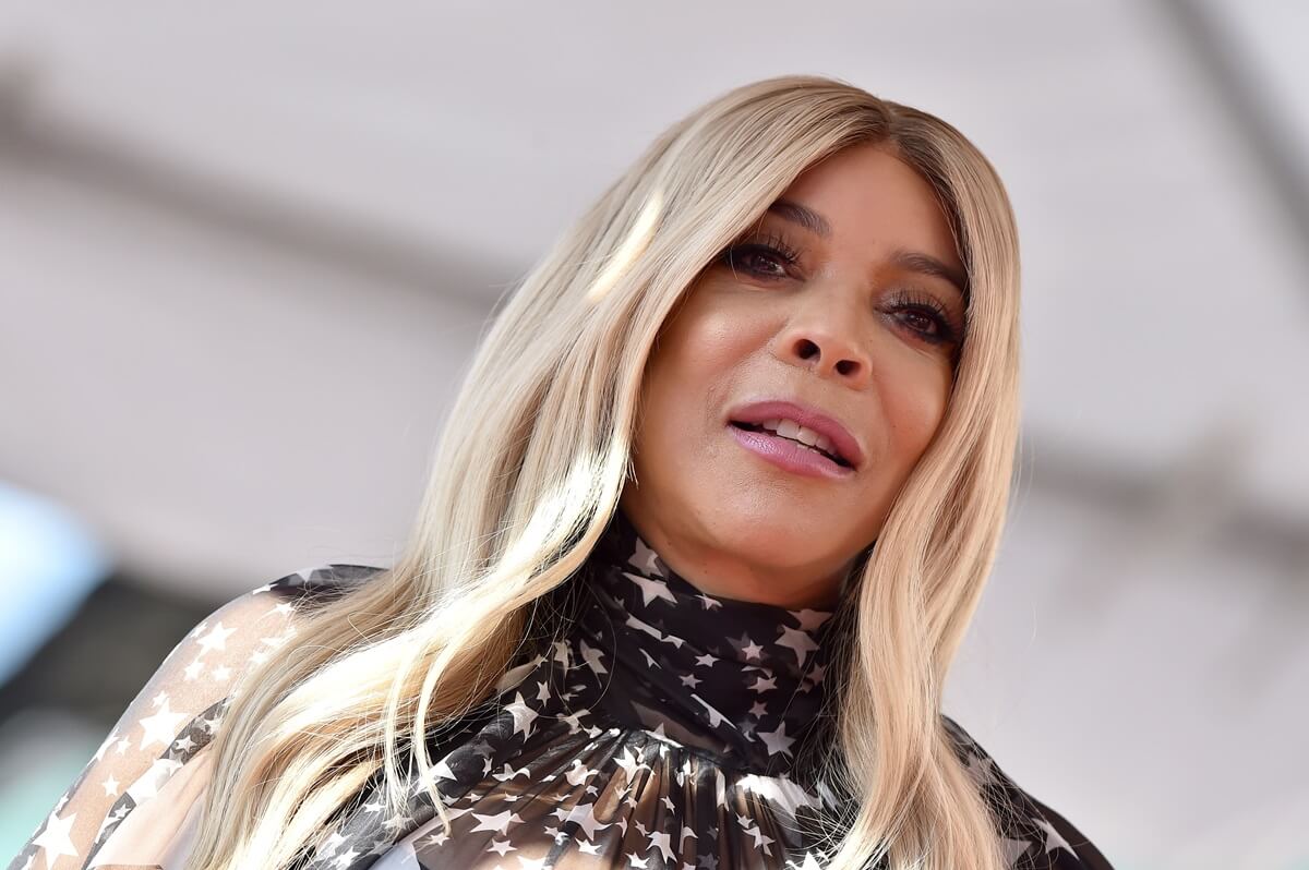 Wendy Williams in a dress being honored with Star on the Hollywood Walk of Fame.