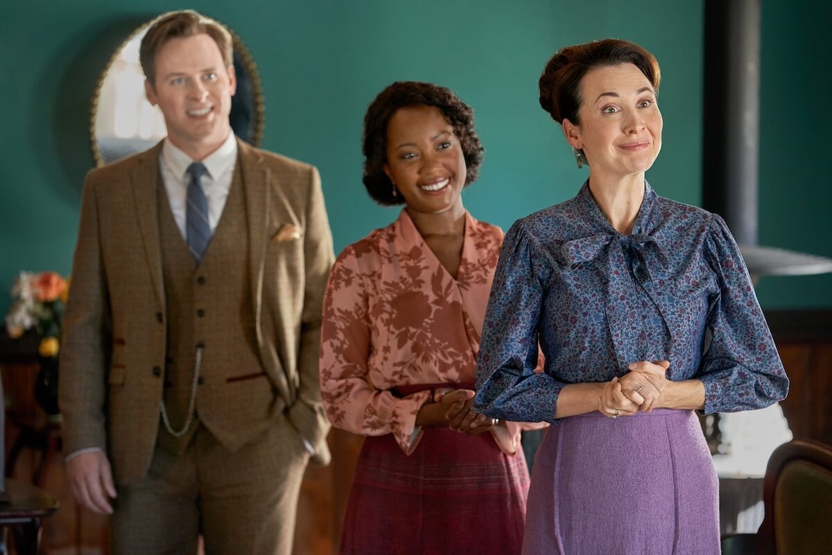 Hickam, Minnie, and Florence standing in a row and smiling in the 'When Calls the Heart' Season 11 premiere