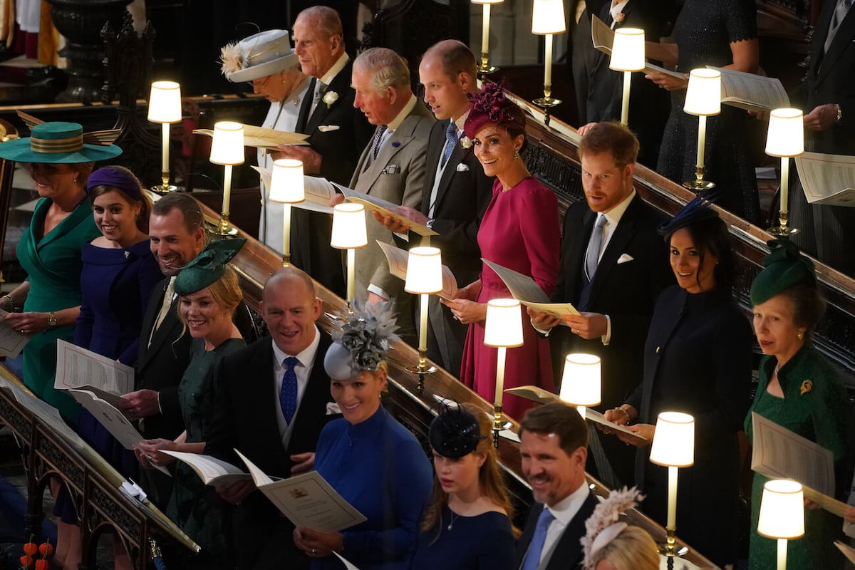 Zara and Mike Tindall sit with other royals at Princess Eugenie's wedding