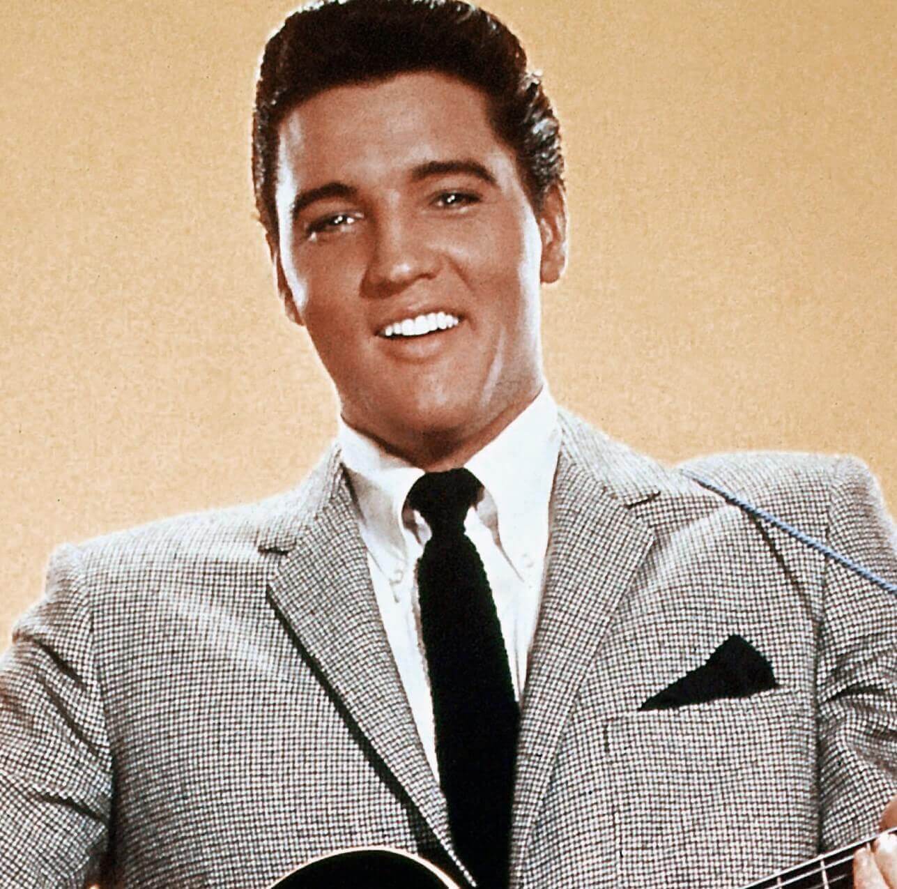 "A Little Less Conversation" singer Elvis Presley wearing a suit