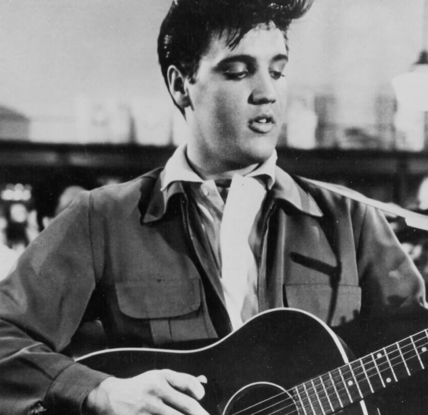 Elvis Presley playing guitar