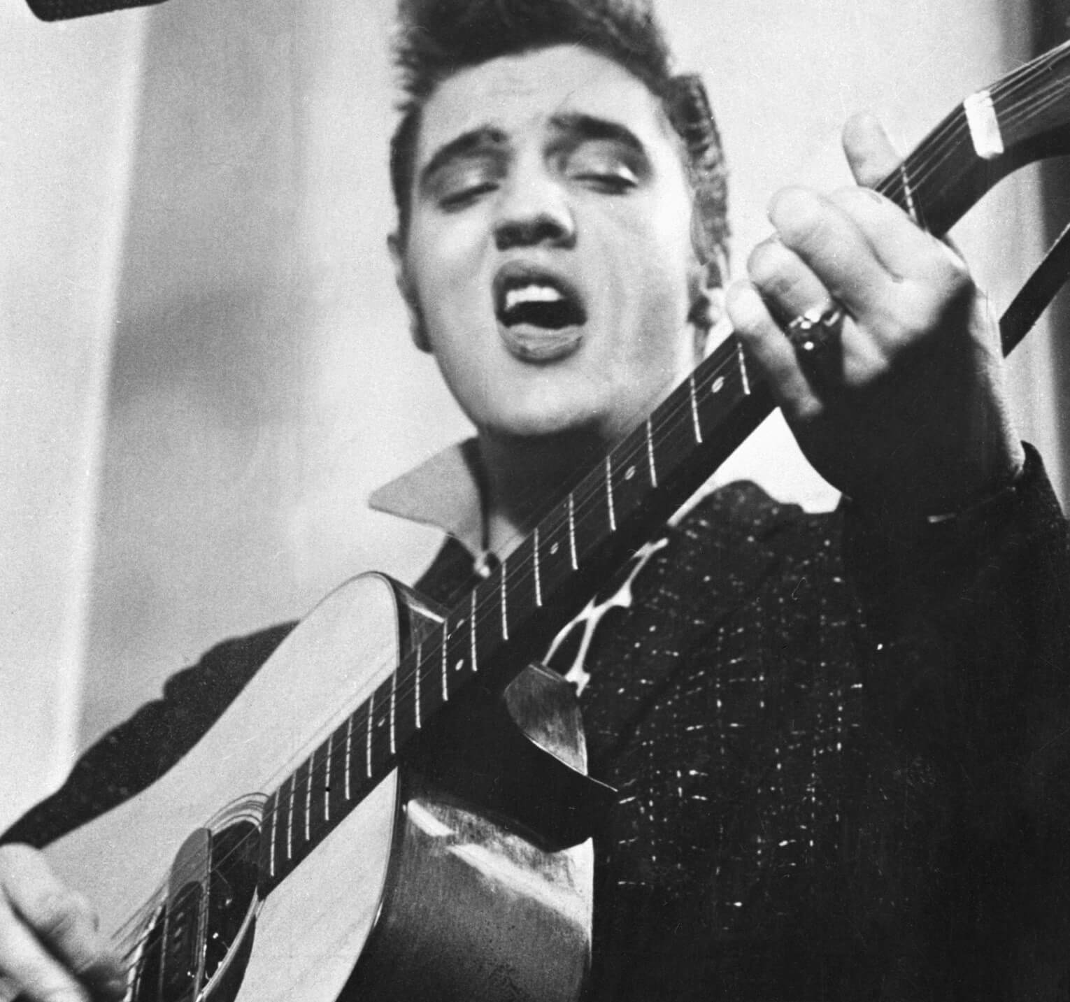 "In the Ghetto" singer Elvis Presley with a guitar