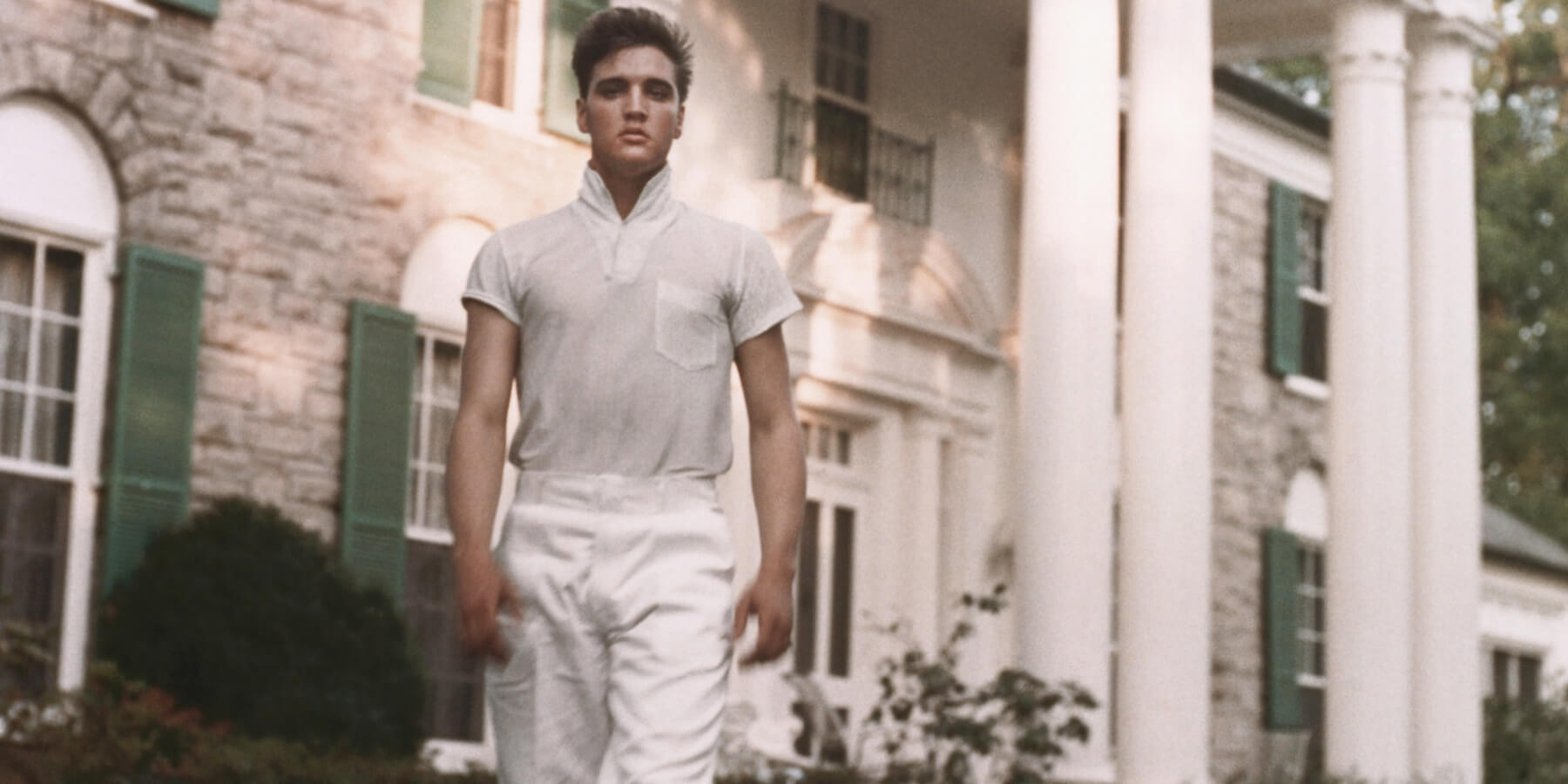 Elvis Presley outside of his Graceland home in Memphis, Tennessee