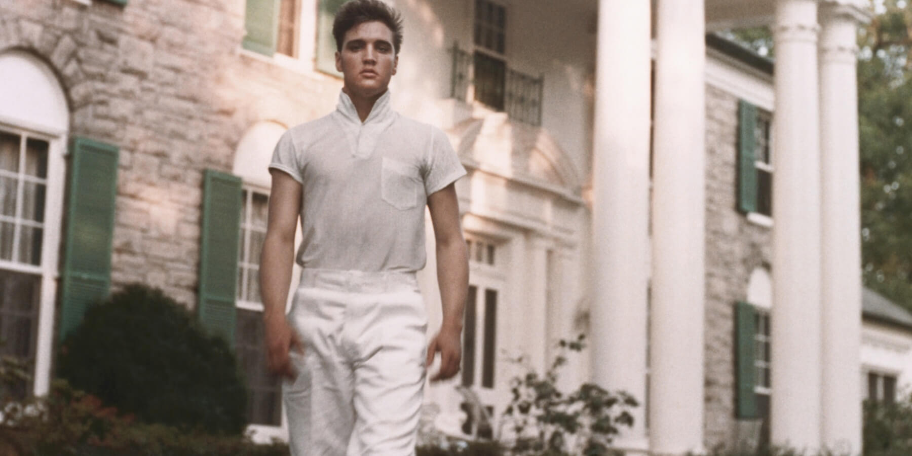 Elvis Presley photographed outside of his Graceland home.